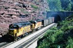 Chessie, C&O GP30 4207- CSXT SD40 8251 exit the tunnel westbound at the crest of Sand Patch grade on the ex-B&O Keystone sub. Sand Patch, Pennsylvania. June 14, 1990. 